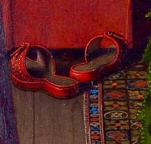 Dettaglio delle pantofoline nel dipinto Ritratto dei coniugi Arnolfini di Jan Van Eyck
